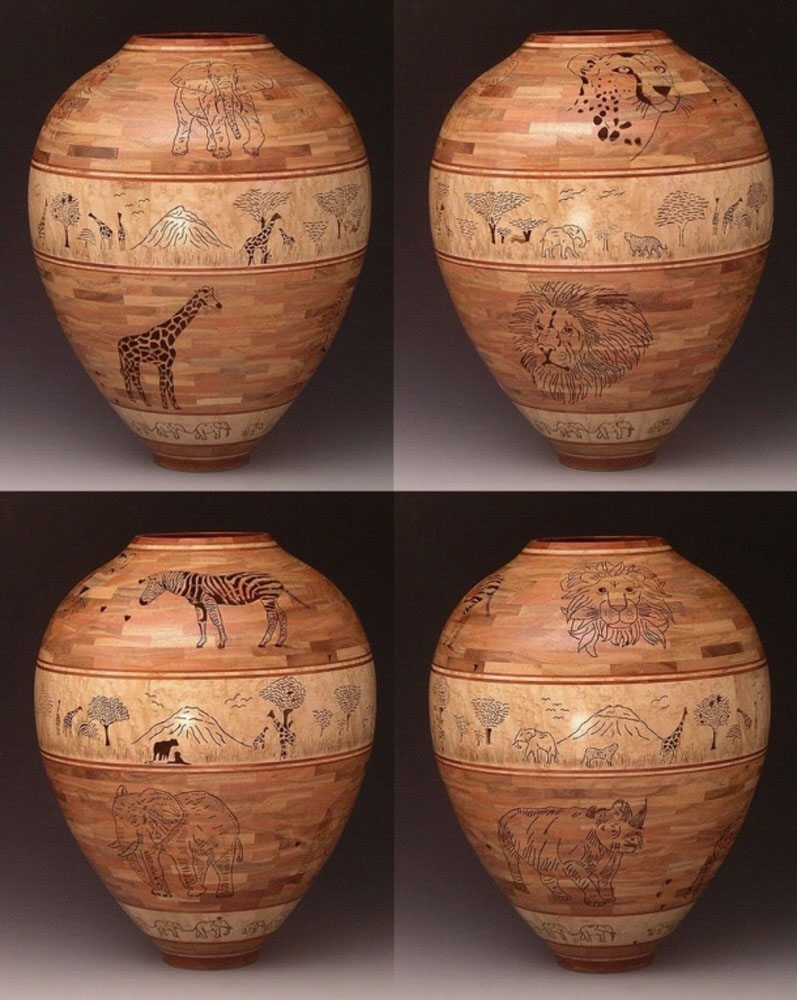 four wooden vases with animals painted on them