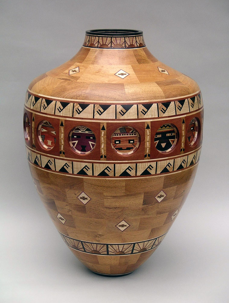 segmented wood turning vase with animal faces