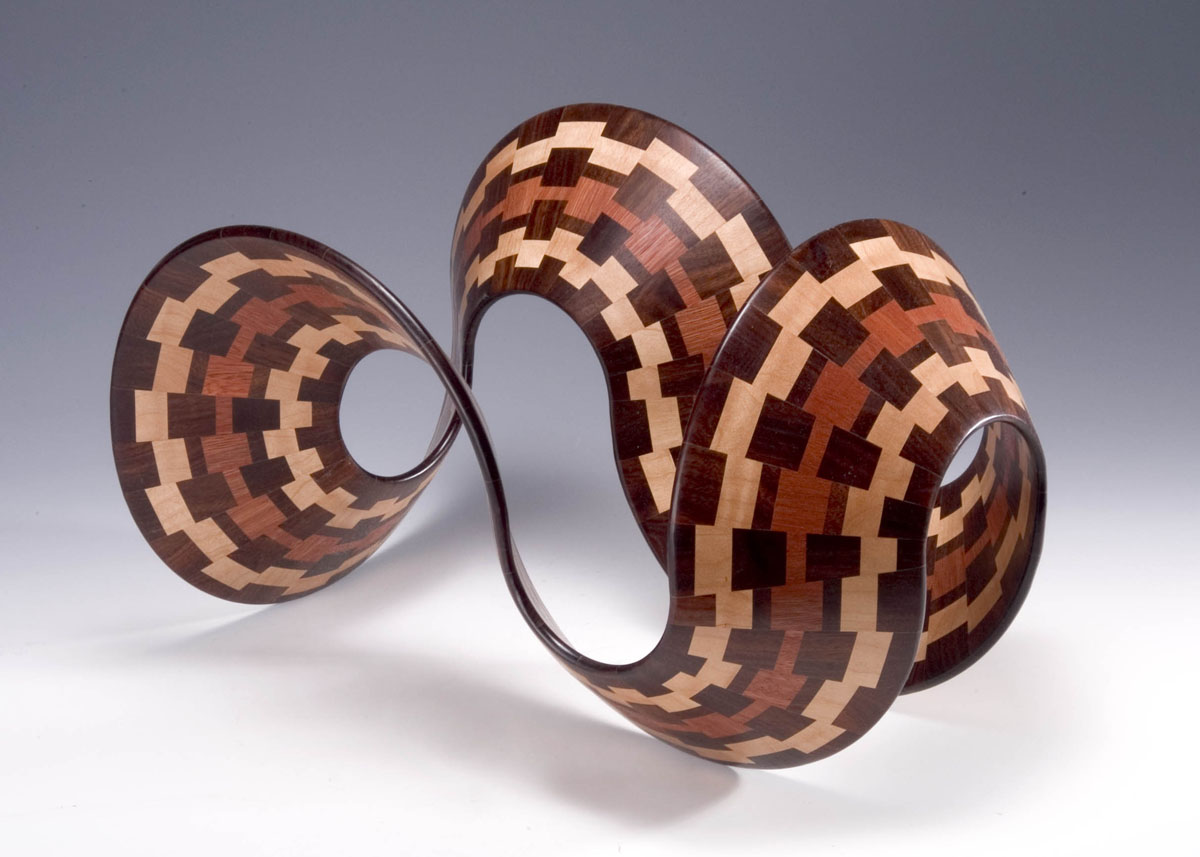 a patterned ribbon of wood made with segmented wood turning