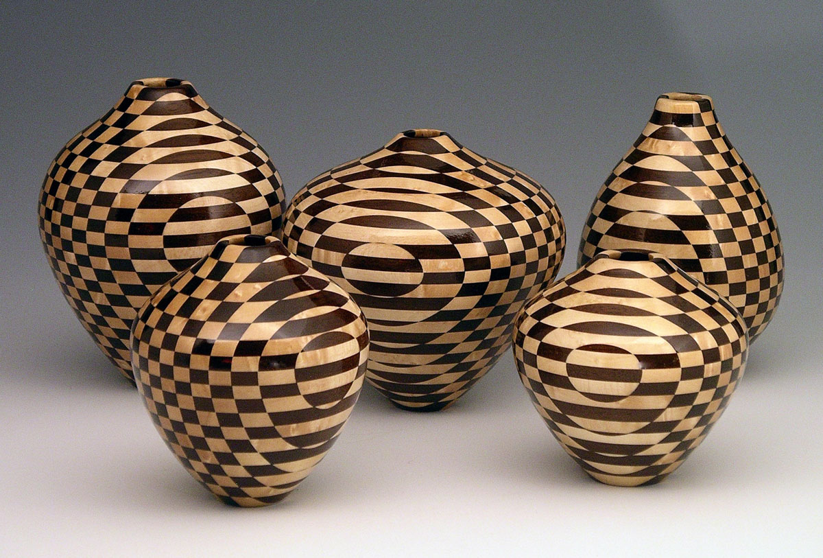 five patterned segmented wood turning vases
