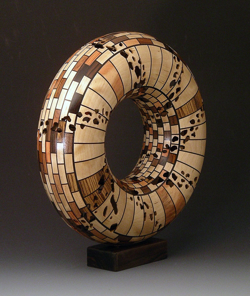 patterned segmented wood turning ring mounted vertically