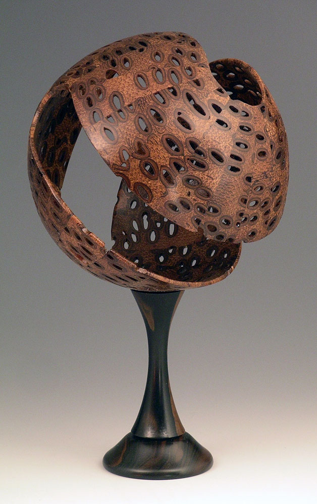 wooden sphere on pedestal made with segmented wood turning