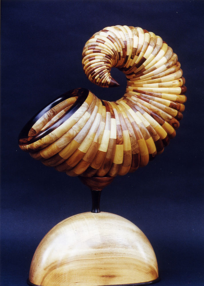 a wooden cornucopia mounted on a wooden block