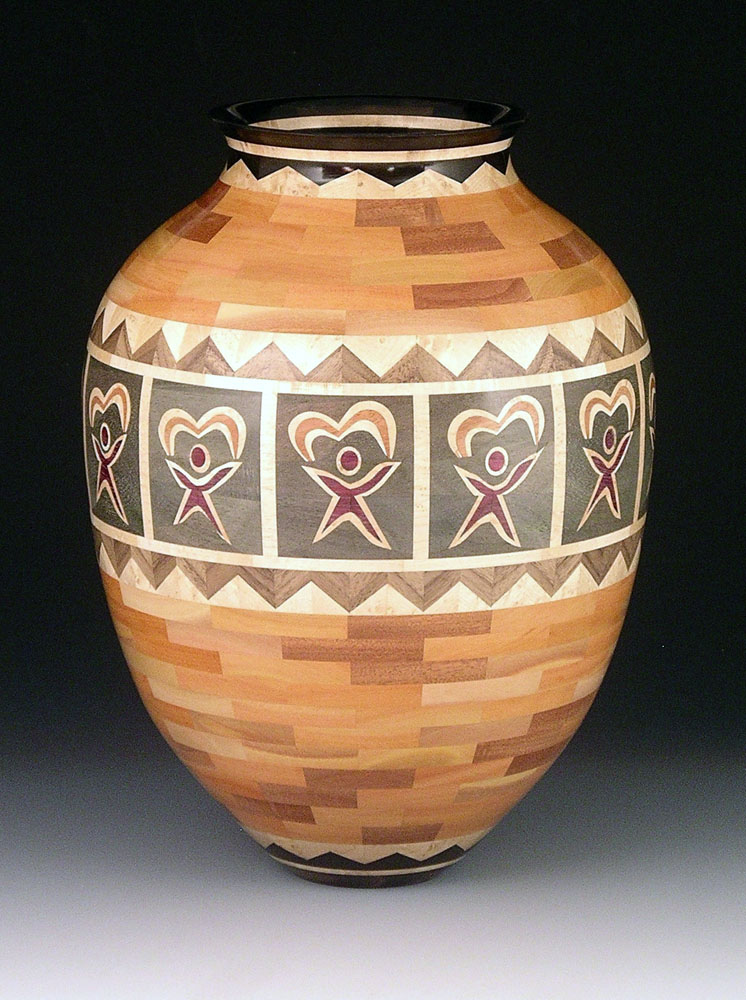 segmented wood turning vase with people and hearts
