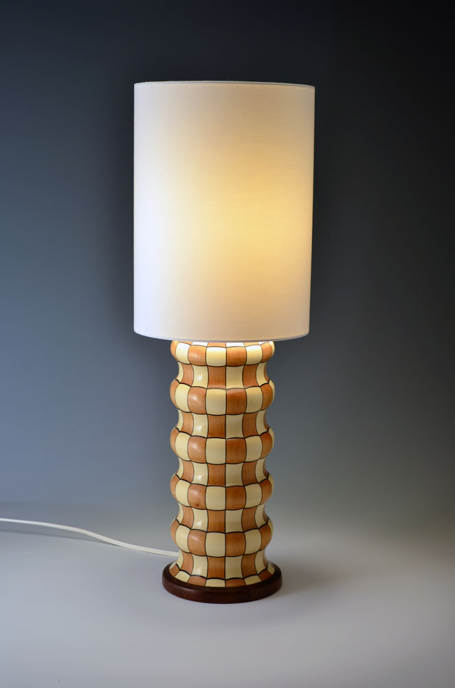 brown and white checkered lamp with white lampshade