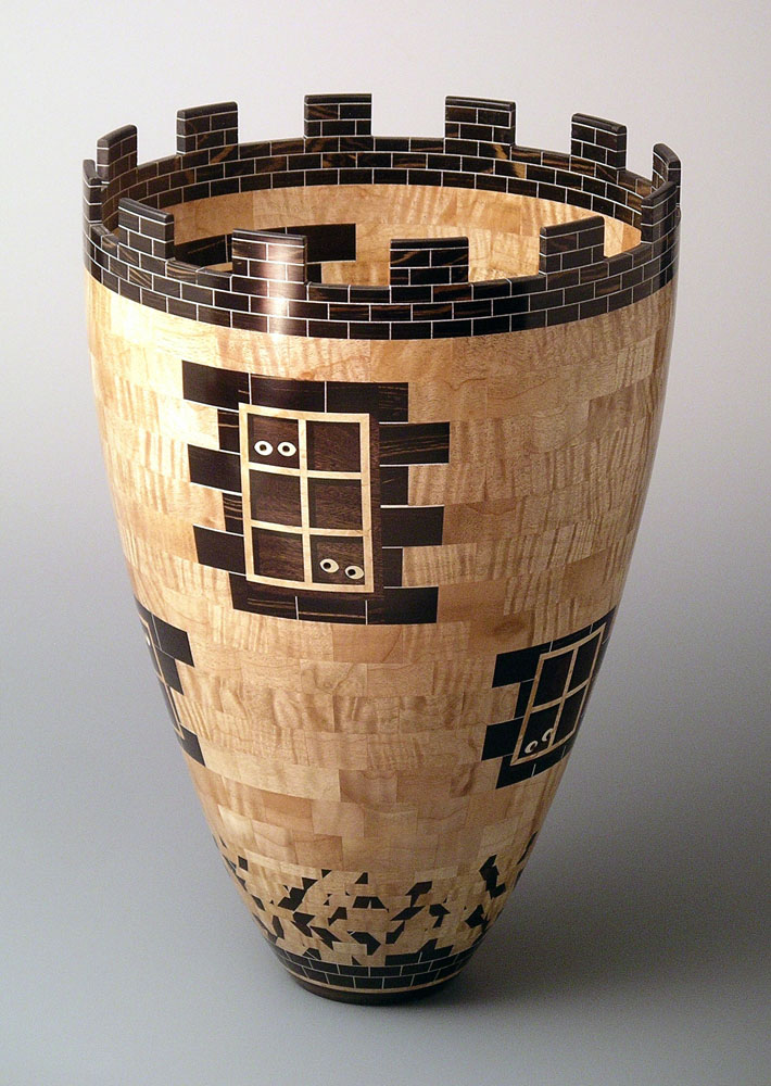 segmented wood turning vase that looks like a castle tower