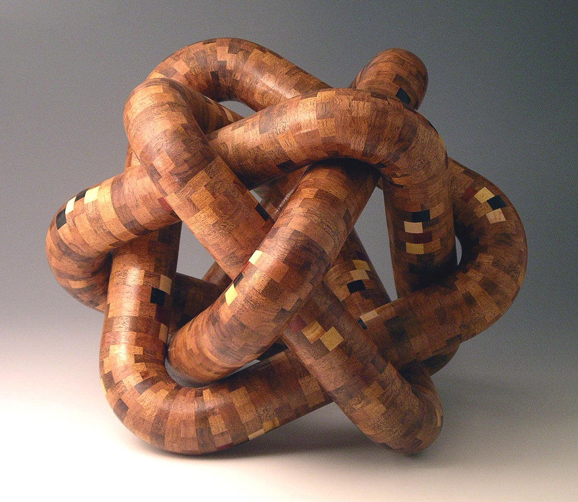 segmented wood turning tubes twisted into a sculpture