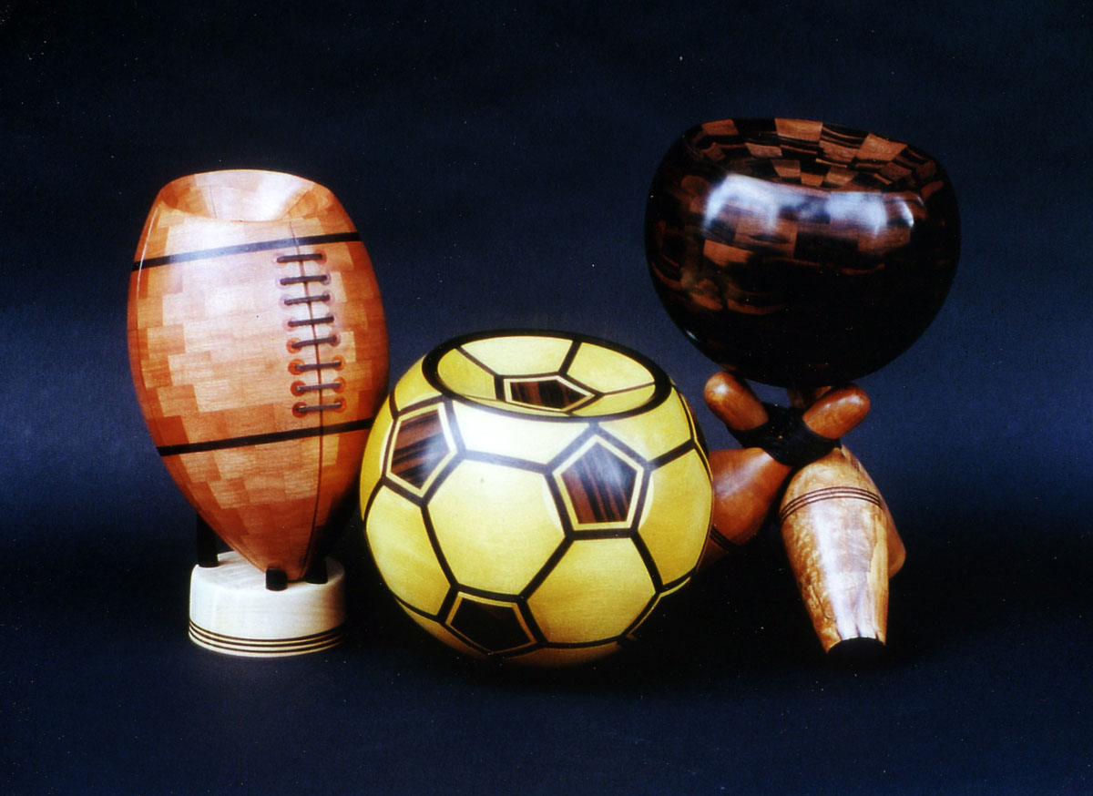 a football, and soccer ball made from segmented wood turning