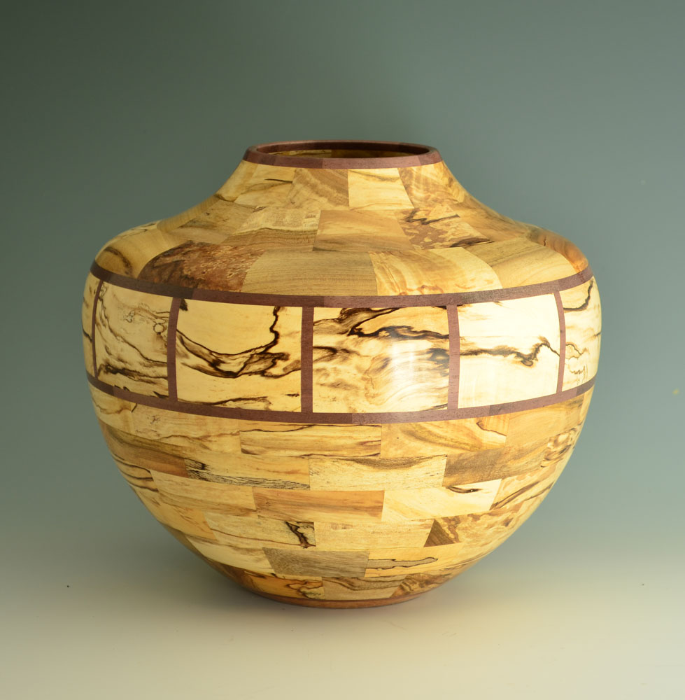 segmented wood turning vessel with marbling texture inlay