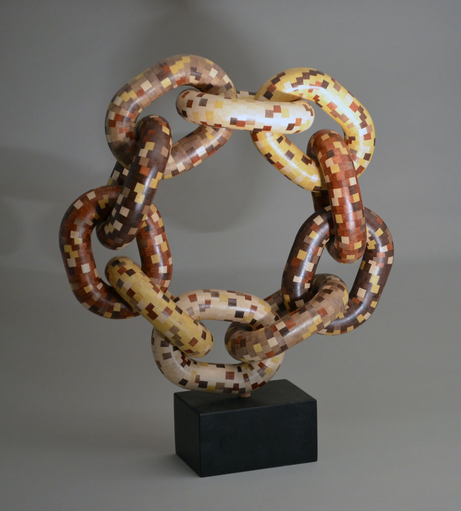 segmented wood turning links woven into a chainlink circle